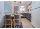 Eat-in kitchen with gray cabinets and a small breakfast nook at 1205 Chevy Chase Dr, Sun City Center, FL 33573