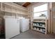 Laundry room with washer, dryer, and ample shelving at 1205 Chevy Chase Dr, Sun City Center, FL 33573