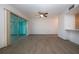 Living area with sliding doors to sunroom and wood floors at 1205 Chevy Chase Dr, Sun City Center, FL 33573