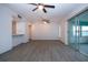 Living room with wood-like floors and ceiling fans at 1205 Chevy Chase Dr, Sun City Center, FL 33573