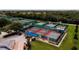 Aerial view of well-maintained tennis and pickleball courts at 1205 Chevy Chase Dr, Sun City Center, FL 33573