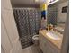Bathroom with shower/tub combo and granite vanity at 12500 Capri Cir N # 302, Treasure Island, FL 33706