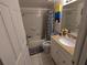 Clean bathroom with tub, shower, and granite vanity at 12500 Capri Cir N # 302, Treasure Island, FL 33706