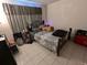 Bedroom with a bed, nightstand and window coverings at 12500 Capri Cir N # 302, Treasure Island, FL 33706