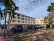 Two-story condo building with parking and landscaping at 12500 Capri Cir N # 302, Treasure Island, FL 33706