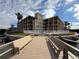 Condo building with pool and waterfront walkway at 12500 Capri Cir N # 302, Treasure Island, FL 33706