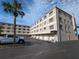 Condo building with parking and tropical landscaping at 12500 Capri Cir N # 302, Treasure Island, FL 33706