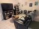 Living room with large TV, bookshelves and comfy seating at 12500 Capri Cir N # 302, Treasure Island, FL 33706