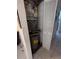 Utility closet with water heater and AC unit at 12500 Capri Cir N # 302, Treasure Island, FL 33706