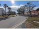 Residential street with houses and palm trees at 12500 Capri Cir N # 302, Treasure Island, FL 33706