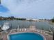 Elevated view of waterfront pool and lounge area at 12500 Capri Cir N # 302, Treasure Island, FL 33706