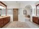 Elegant bathroom with double vanity, soaking tub, and walk-in shower at 16312 Dunlindale Dr, Lithia, FL 33547