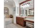 Spa-like bathroom with a large vanity and soaking tub at 16312 Dunlindale Dr, Lithia, FL 33547