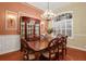 Formal dining room with hardwood floors, chandelier, and large windows at 16312 Dunlindale Dr, Lithia, FL 33547