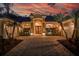 Elegant home exterior with a grand entrance and palm trees at 16312 Dunlindale Dr, Lithia, FL 33547