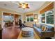 Gathering room with sliding doors that open to a pool and outdoor kitchen at 16312 Dunlindale Dr, Lithia, FL 33547