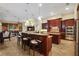 Island kitchen features breakfast bar, stainless steel appliances, and ample counter space at 16312 Dunlindale Dr, Lithia, FL 33547