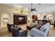 Bright and airy living room with built-in entertainment center and large windows at 16312 Dunlindale Dr, Lithia, FL 33547