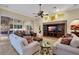 Living room with built-in entertainment center and comfortable seating at 16312 Dunlindale Dr, Lithia, FL 33547