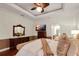 Bright and airy main bedroom with a king-size bed and sitting area at 16312 Dunlindale Dr, Lithia, FL 33547