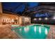 Night view of a resort-style pool and spa at 16312 Dunlindale Dr, Lithia, FL 33547