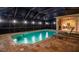 Night view of a screened-in pool and spa at 16312 Dunlindale Dr, Lithia, FL 33547