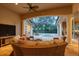 Relaxing pool area with a covered patio and comfortable seating at 16312 Dunlindale Dr, Lithia, FL 33547