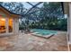 Inviting swimming pool with a spa and a screened enclosure at 16312 Dunlindale Dr, Lithia, FL 33547