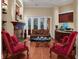 Cozy sitting area with fireplace, comfortable seating, and hardwood floors at 16312 Dunlindale Dr, Lithia, FL 33547