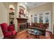 Fireside sitting room with hardwood floors, and a charming, cozy atmosphere at 16312 Dunlindale Dr, Lithia, FL 33547