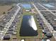Community overview, aerial view of neighborhood with lake at 16719 Delia St, Wimauma, FL 33598