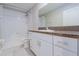 Bathroom features a shower/tub combo and white vanity at 16719 Delia St, Wimauma, FL 33598