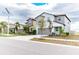Two-story house with gray siding, gray garage door and blue front door at 16719 Delia St, Wimauma, FL 33598