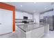 Modern kitchen with white cabinets, granite countertops, and stainless steel appliances at 16719 Delia St, Wimauma, FL 33598