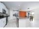 Modern kitchen with stainless steel appliances and granite countertops at 16719 Delia St, Wimauma, FL 33598