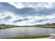 Calm lake view with houses and cloudy sky at 16719 Delia St, Wimauma, FL 33598