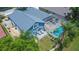 An aerial view showcasing a house with a pool and large backyard at 2015 Wexford Green Dr, Valrico, FL 33594