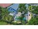 Aerial view of a house with a pool and lush landscaping at 2015 Wexford Green Dr, Valrico, FL 33594