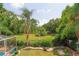 Landscaped backyard with lush greenery, offering a tranquil outdoor space at 2015 Wexford Green Dr, Valrico, FL 33594