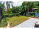 Landscaped backyard with deck and lush greenery at 2015 Wexford Green Dr, Valrico, FL 33594