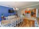 Bright dining room with hardwood floors and kitchen view at 2015 Wexford Green Dr, Valrico, FL 33594