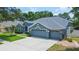 Stunning curb appeal with a well-maintained lawn and two-car garage at 2015 Wexford Green Dr, Valrico, FL 33594