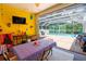 Indoor patio with a view of the pool, dining table and game area at 2015 Wexford Green Dr, Valrico, FL 33594