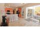 Open kitchen with breakfast bar and access to the backyard patio at 2015 Wexford Green Dr, Valrico, FL 33594