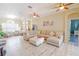 Spacious living room with large sectional sofa and tile floors at 2015 Wexford Green Dr, Valrico, FL 33594