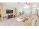 Bright living room featuring a sectional sofa and flat-screen TV at 2015 Wexford Green Dr, Valrico, FL 33594