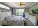 Main bedroom with king-size bed, large window, and ample closet space at 2015 Wexford Green Dr, Valrico, FL 33594