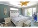 Relaxing main bedroom with a king-size bed and ceiling fan at 2015 Wexford Green Dr, Valrico, FL 33594