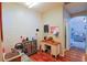 Home office with wood floors and built-in shelving at 2015 Wexford Green Dr, Valrico, FL 33594