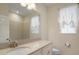 Clean bathroom with a vanity, toilet and two windows at 211 Shell Creek Ct, Apollo Beach, FL 33572